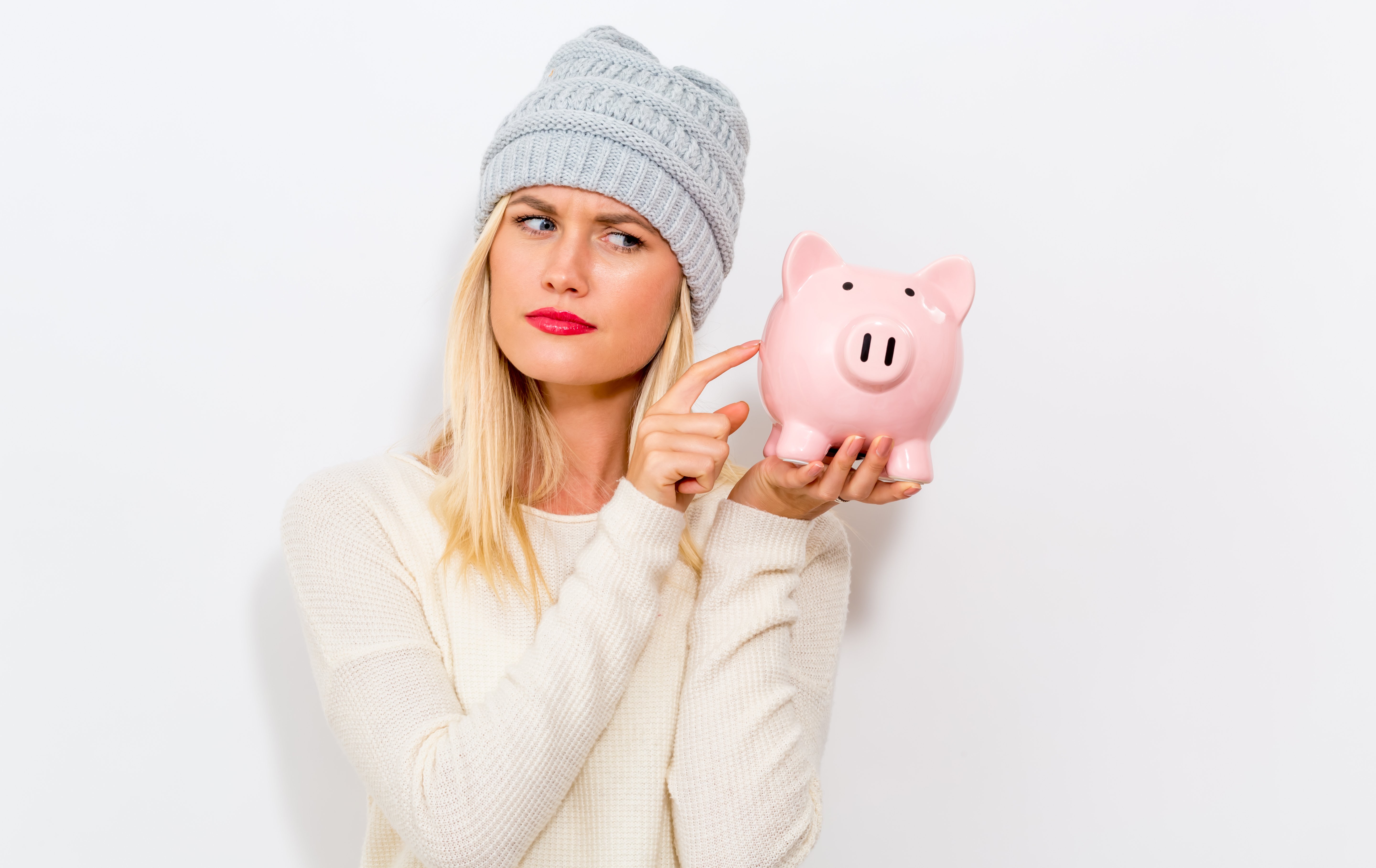 winter-clad-woman-with-a-savings-bank-SBI-317617957